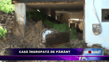 Casă îngropată de pământ