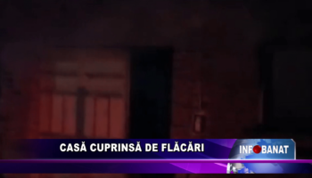 Casă cuprinsă de flăcări